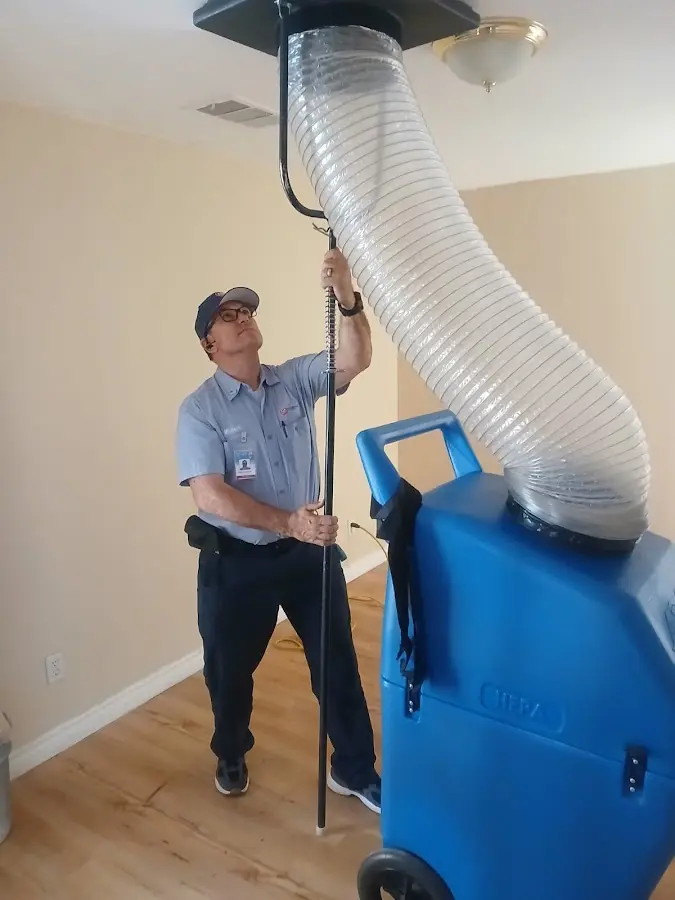 HVAC Installation technician using HEPA equipment in Alvin
